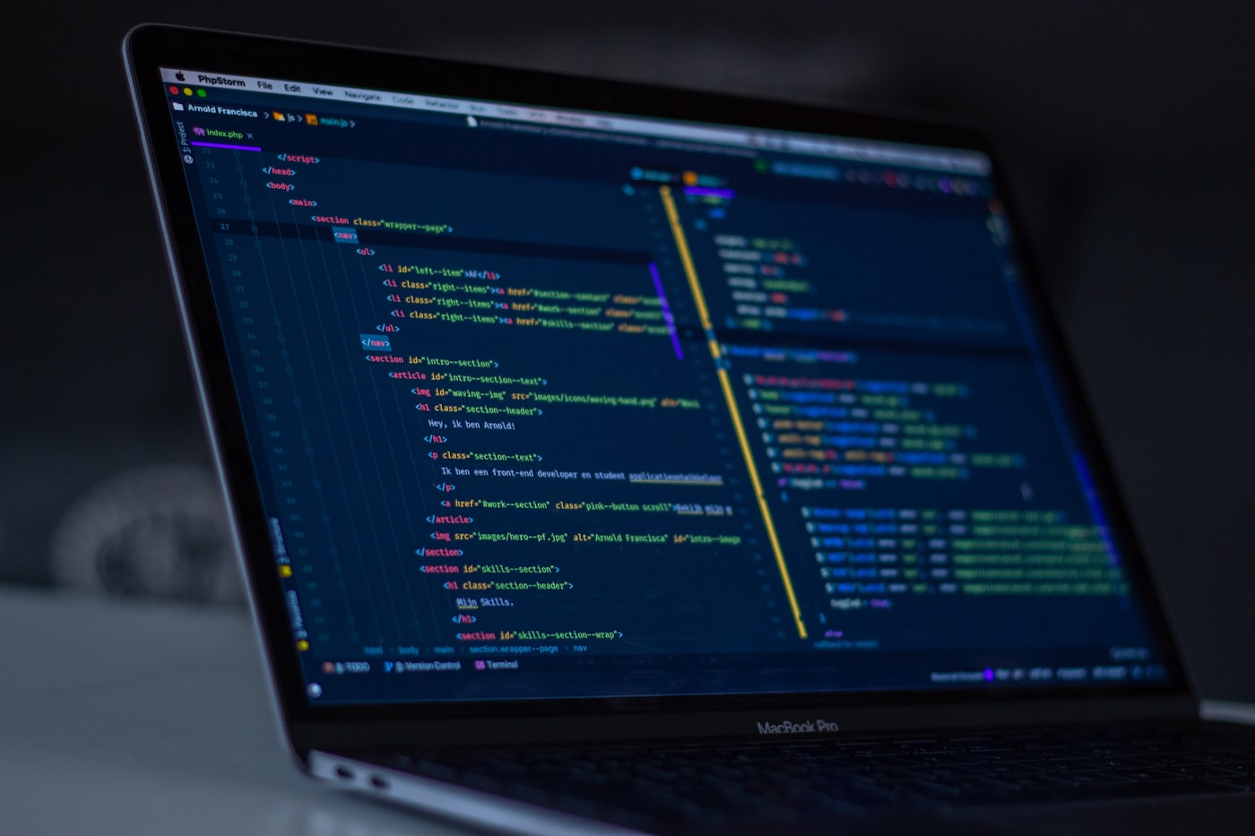 Close-up of a laptop screen with code and command interface details in a working deployment environment.